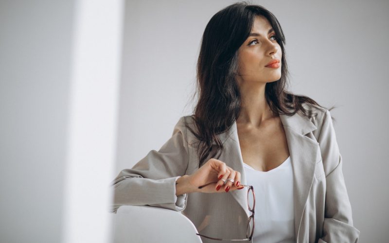 Portrait of a young business woman sitting in office